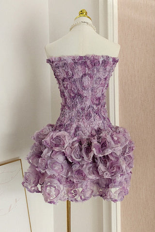 Strapless fitted mini dress with 3D floral ruffles and ruched bodice.
