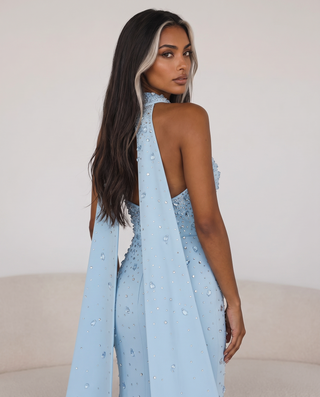 Crystal-Embellished Strapless Gown – Statement Neckline & Flowing Back Cape