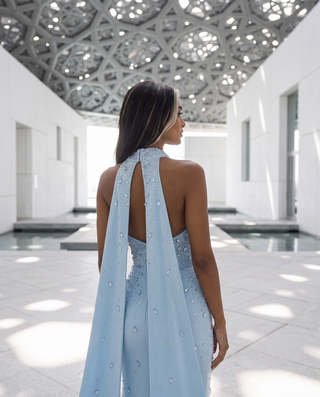 Crystal-Embellished Strapless Gown – Statement Neckline & Flowing Back Cape