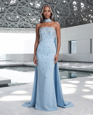 Crystal-Embellished Strapless Gown – Statement Neckline & Flowing Back Cape